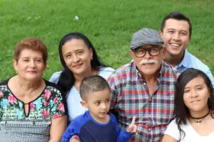 Happy immigrant family together after successful reunification.